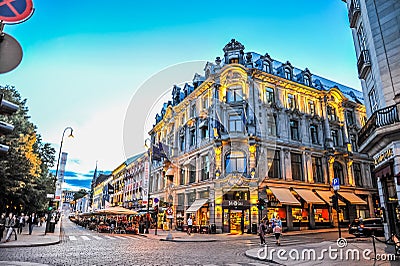 OSLO, NORWAY: People walking around in Karl Johans Gate, the famous street of Oslo in the evening Editorial Stock Photo