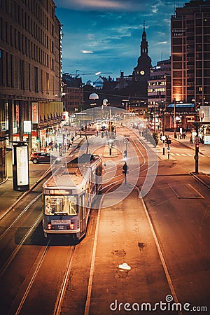 Trams running in front of Oslo train station, city night views in the business district from above Editorial Stock Photo