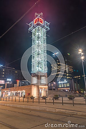 Night view for illuminated clock tower on Ruter Help Center Public Transport at Jernbanetorget square Editorial Stock Photo