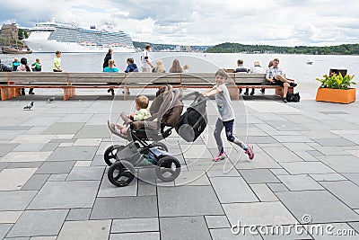 Oslo people enjoying on Aker Brygge Editorial Stock Photo