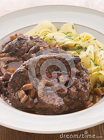 Osso Bucco alla Milanaise with Tagliatelle Stock Photo