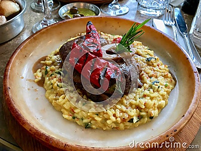 Osso Buco, Veal Shanks that are Braised in Wine with Saffron Risotto, Roasted Red Pepper and Rosemary. Stock Photo