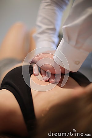Osteopath manipulating a patient Stock Photo