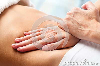 Osteopathic belly massage. Stock Photo