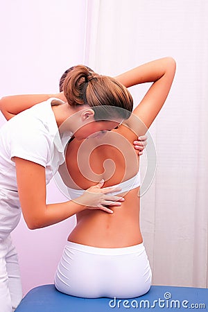 Osteopathic technique in rotation dorsal column Stock Photo