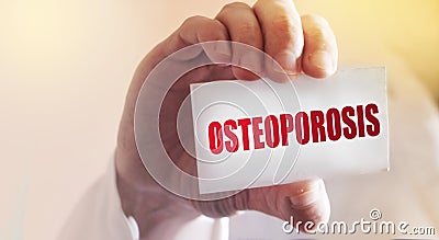 OSTEOPOROSIS word on doctor`s card. Healthcare and medical concept Stock Photo