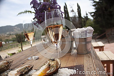 Cup with sparkling rose wine next to glass for red wine waiting for marriage wine culture and gastronomy at the same table Stock Photo