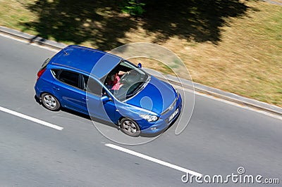 Blue Hyundai i30 1st generation FD with motion blur effect Editorial Stock Photo