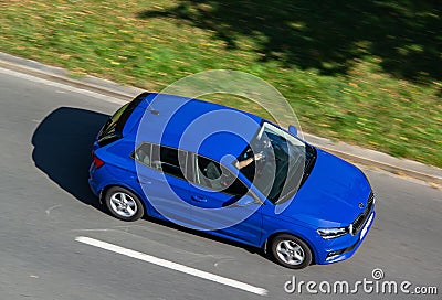 Blue Skoda Fabia IV vehicle with strong motion blur effect in top view Editorial Stock Photo