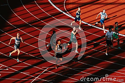 Dynamic 400m Male Race Bend: Play of Light and Shadow in Track and Field Scene for Worlds in Editorial Stock Photo