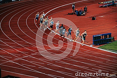 Male Runners Engaged in 800m Race: Athletes Compete on Track and Field Circuit for Worlds in Editorial Stock Photo