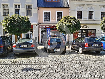 Ostrov nad Ohri, Czech republic - September 2012: old houses and parked cars on Stare Namesti square at end of summer Editorial Stock Photo