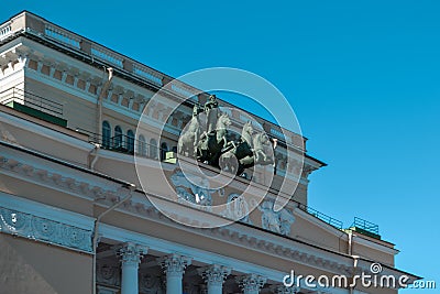 Ostrovsky Square, Saint Petersburg, Russia, 11.10.2020. Ancient green sculpture of cavalry with horses stands on facade of yellow Editorial Stock Photo