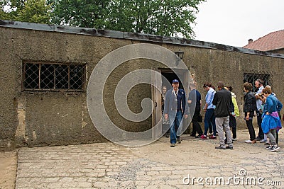 Visitors Filing into Auschwitz Gas Chamber Editorial Stock Photo