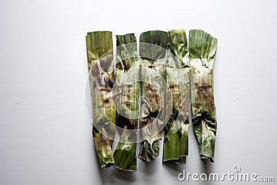 Otak-otak - Traditional food from Indonesia is a kind of snack - grilled fish cakes wrapped with banana leaf Stock Photo