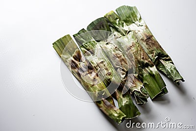 Otak-otak - Traditional food from Indonesia is a kind of snack - grilled fish cakes wrapped with banana leaf Stock Photo