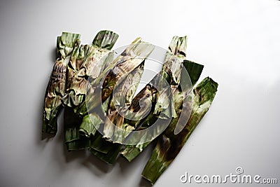 Otak-otak - Traditional food from Indonesia is a kind of snack - grilled fish cakes wrapped with banana leaf Stock Photo