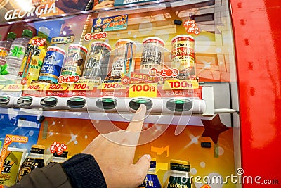 Hand of one people pressing to buy canned soft drink Editorial Stock Photo