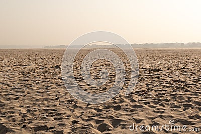The other side of the Ganges with sand dunes, Land of the dead, Varanasi, India Stock Photo