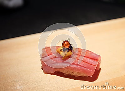 Otoro sushi topped bluefin tuna belly with Sea urchin uni, caviar and gold flake Stock Photo