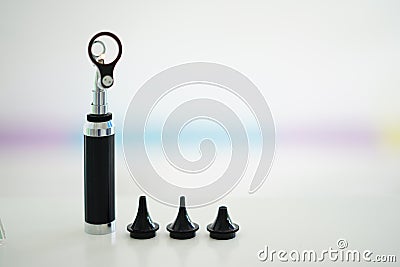 Otoscope for ear check for ear doctor ENT with specula pieces on blur background with copy space Stock Photo