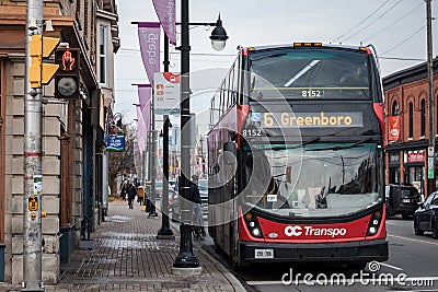 OC Transpo logo on one of their urban buses in downtown Ottawa. Editorial Stock Photo