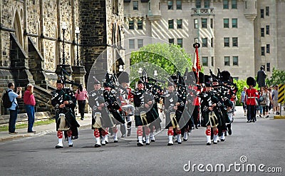 OTTAWA, CANADA - 08 08 2011: Pipers Band approaching the Parliament Hill during Changing Guard Ceremony in Ottawa, the Editorial Stock Photo