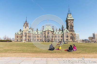 Ottawa, Canada - 15th April 2016: People resting on the grass in Editorial Stock Photo