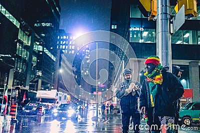 Happy Black Protester Male in the Street at Night Under Rain During Freedom Convoy Protest in Ottawa Editorial Stock Photo