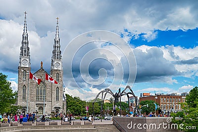 Notre Dame cathedral and Maman spider scuplture in Ottawa, Canad Editorial Stock Photo