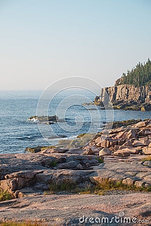 Otter Cliffs in the background with slabs of Pink Granite Rocks Stock Photo