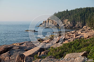 Otter Cliffs and slabs of Pink Granite Rocks left over from the Stock Photo