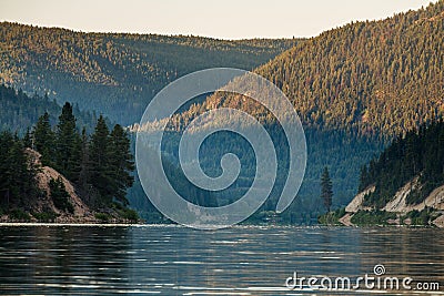 Otter lake in the morning light with forest Stock Photo