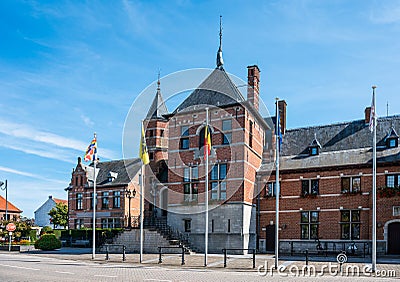 Oud-Turnhout, Antwerp Province, Belgium - Town hall with flags of the old village center Editorial Stock Photo