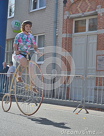 WoMan driving on a Retro pre war Bike Editorial Stock Photo