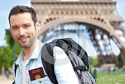 Oung attractive traveler in Paris with passport Stock Photo