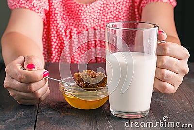 Oung woman having healthy breakfast in kitchen Stock Photo