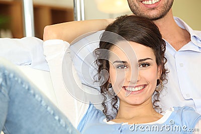 Ouple sitting on a sofa Stock Photo