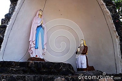 Our Lady of Lourdes Cave in front of St. Blaise Catholic Church in Gandaulim, Goa, India Editorial Stock Photo