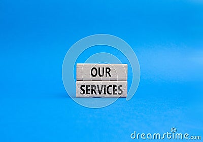 Our services symbol. Concept words Our services on wooden blocks. Beautiful blue background. Business and Our services concept. Stock Photo