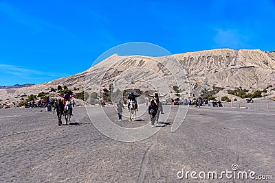 Tourists Horse riding services at Mount Bromo. Editorial Stock Photo