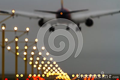 Out of focus airliner and runway lights Stock Photo