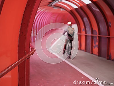 Commuting Cyclist In Urban Walkway Stock Photo