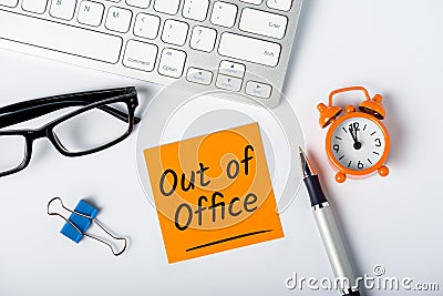 Out of office - memo on office workplace. Holiday Announcement, Day Off or Quarantine Covid-19 Stock Photo
