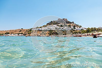 Out of the water view of Lindos village with ruins. Stock Photo