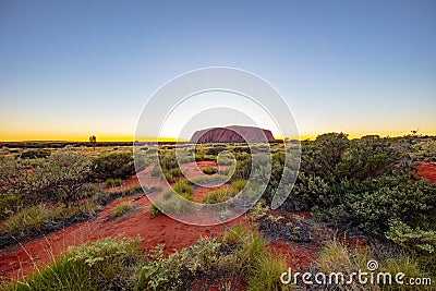 Outback, Australia - November 12, 2022: Sunrise at the Majestic Uluru or Ayers Rock at in the Northern Territory, Australia. The Editorial Stock Photo