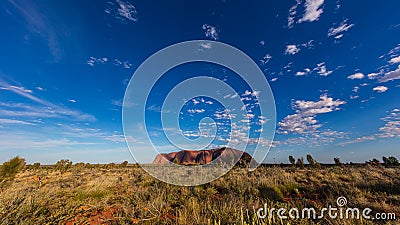 Outback, Australia - November 12, 2022: Sunrise at the Majestic Uluru or Ayers Rock at in the Northern Territory, Australia. The Editorial Stock Photo