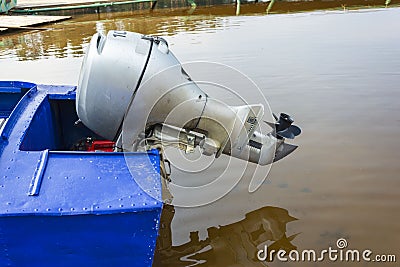 Outboard motor on a blue aluminum fishing boat, outboard motor on a pleasure boat Stock Photo