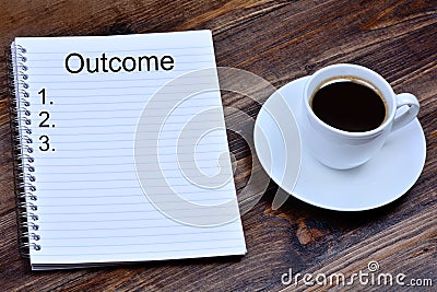 Outcome word on notebook Stock Photo