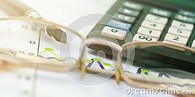 Outdated calculator with coloured buttons and black quill Stock Photo